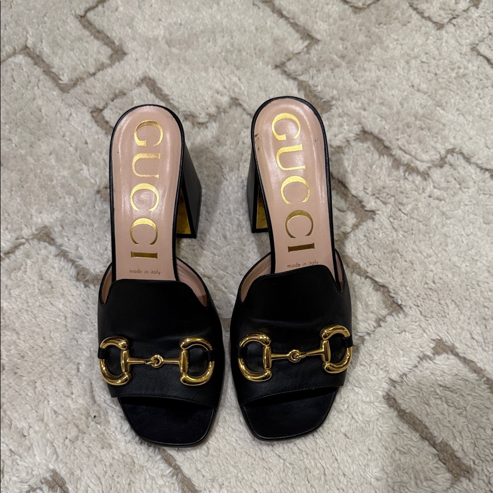 Gucci Black Mules with Gold Accents